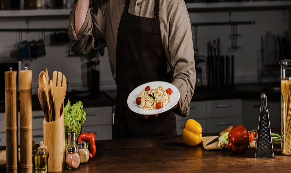 Chef Holding Plate With Pasta and Making Ok Sign